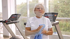 Reabelitation after injury. elderly woman plays sports in the gym. Healthy lifestyle, retired concept, senior, indoor