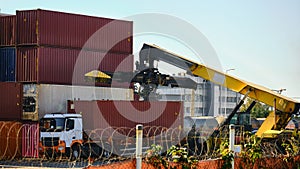 Reach-stacker and container truck