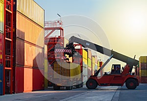 Reach stacker unload container from truck in container yards, Logistics operations.