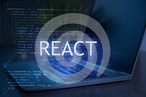React inscription against laptop and code background. Technology concept. Learn react programming language, web development