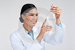 This is the reaction Im looking for. an attractive young female scientist examining a beaker filled with liquid in