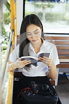 Read the book on bus, vertical