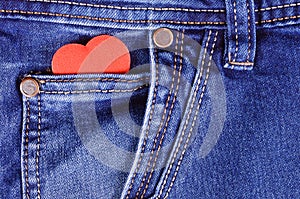 Read heart shape in blue jeans pocket