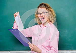 Read impressing resume. Tutor checking homework. Woman smart lady hold tablet documents. Read personal profile. Estimate