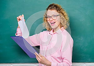 Read impressing resume. Tutor checking homework. Woman smart lady hold tablet documents. Read personal profile. Estimate photo