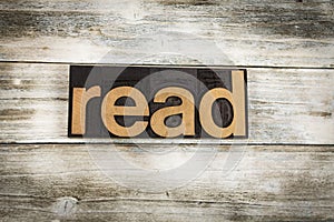 Read Letterpress Word on Wooden Background