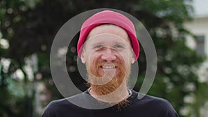 Readhead Hipster in Hat Laughs Suddenly