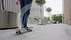 Readhead Hipster in Hat on a Skateboard