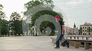 Readhead Hipster in Hat With a Skateboard