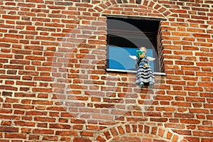 Reading angel in the window