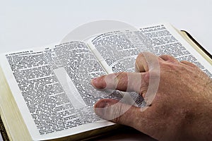 Reading a Bible on White Background