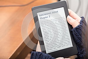 Reading a book with an e-book reader