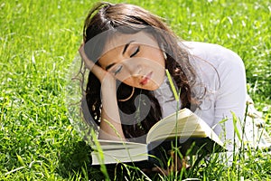 Reading book on grass