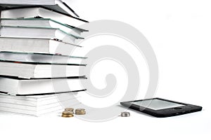 Reading books with E-book. Concept of cheap education. Stack of books and coins on white background