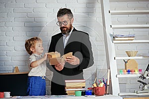 Reading education book, teacher and schoolboy read books together, children education, school kindergarten, interesting