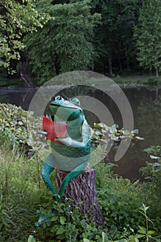 Reading Frog on Tree Stump