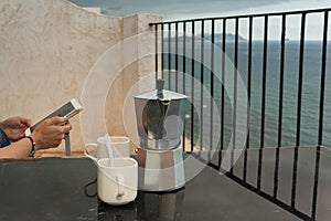 Reading in front of the sea after drinking coffee photo