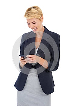 Reading a funny text. a young businesswoman typing a message on her cellphone.