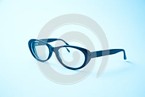 Reading glasses on a light background