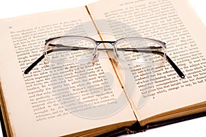 Reading - glasses on an open book