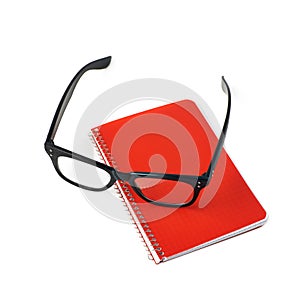 Reading glasses over a notebook