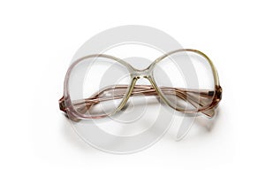 Reading glasses in a plastic frame isolated on a white background