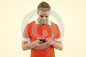 Reading incoming SMS text. Happy man read sms on smartphone isolated on white. Sms messaging. Short message service. SMS