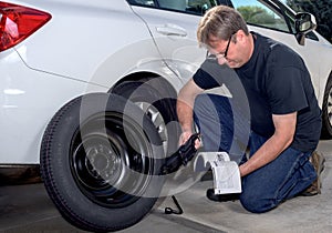 Reading instruction on replacing a spare tire