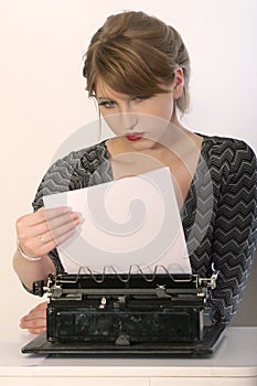 Reading letter on typewriter