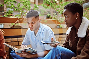 Reading man, black woman or books phone research on university, school or college campus in group study. Students