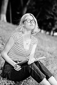 Reading is my hobby. Summer study. woman in park reading book. student girl with book outdoor. interesting story. Relax