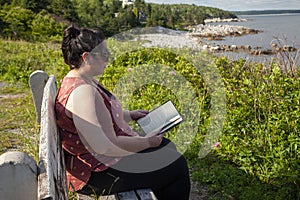 Reading by the ocean