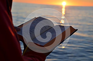 Reading during sunset on the Baltic Sea