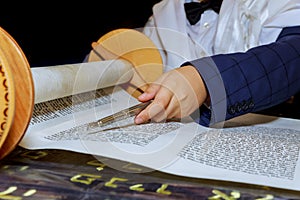 Reading torah, bar mitzva down and praying photo