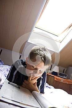 Reading under skylight photo