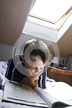 Reading under skylight photo