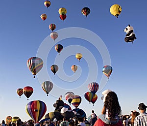 Readington, New Jersey/USA - 7/30/2017: [Festival of Ballooning; Rising Hot Air Balloons Draws Crowds, i.e. Children on Shoulders]