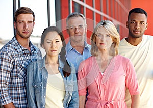 They are ready for business. Portrait of a diverse group of coworkers in a casual office environment.