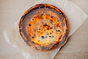 Ready cheesecake with blueberries in a baking dish in the oven