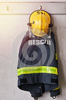 Ready for an emergency. firemens clothing hanging from a wall.