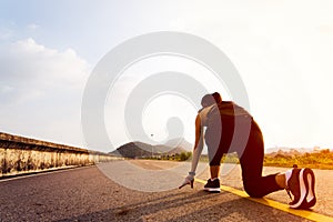 Ready go. running woman on start position and going to run on long road