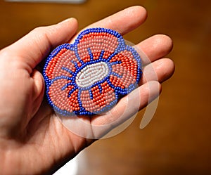 Ready made beaded brooch - red flower with blue outline on a hand - fashion