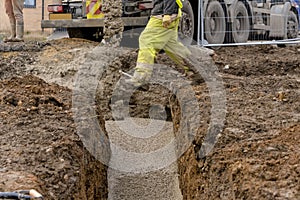 Ready-mix semi-dry concrete delivered on construction site and discharged