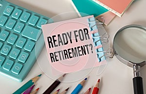 Ready for retirement text on notepad with glasses, pencil on white background