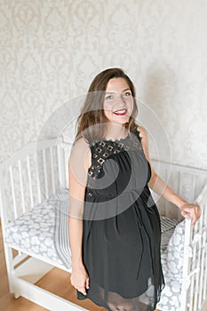 Ready room for the unborn child. girl is ready to bring the child to the room