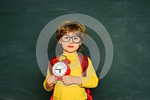 Ready for school. Portrait of the boy who is late in school. Time to learn concept.