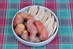 Ready served boiled sweet potato and banana on korean style dish