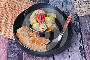 Ready served of Roti , Indian food as deep fried flour ,with Thai green curry
