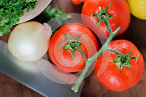 Ready to cook tomatoes and vegetables photo