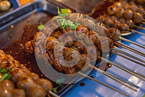 Ready-to-eat meatballs topped with dipping sauce, ready for sale